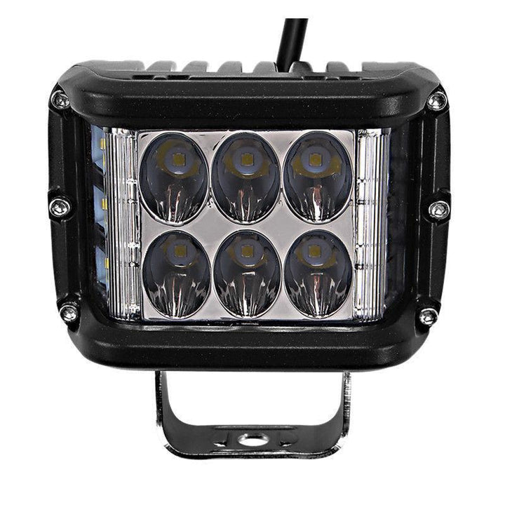 Vehicle-mounted dual color LED pod light in action, emitting a bright amber strobe for caution