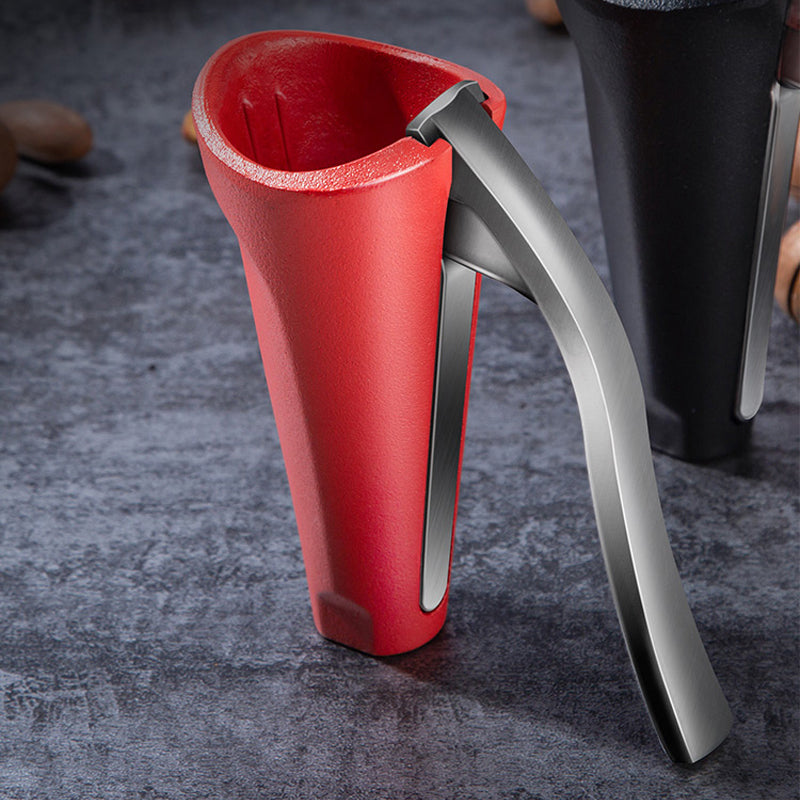 Detailed view of the nut cracker's textured handles, ensuring a firm grip during use.