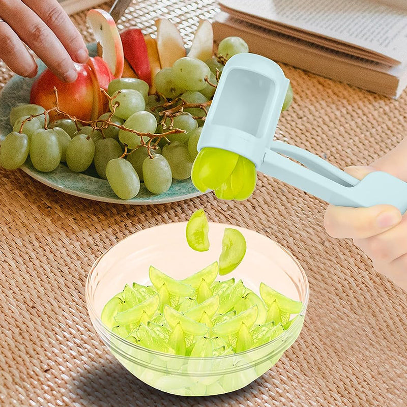Collection of sliced grapes & berries next to the universal quarter slicer tool, ready to eat
