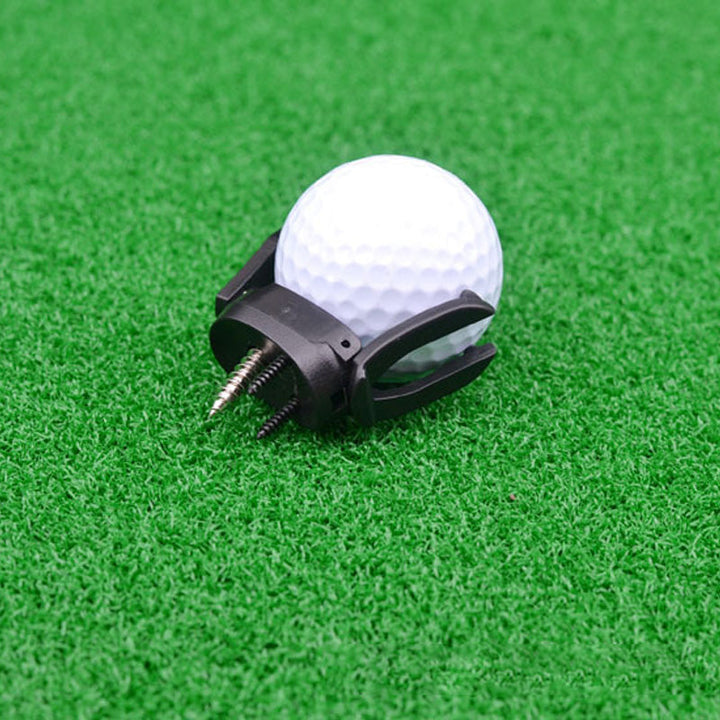 Efficient golf ball retriever, shown attached to a putter, simplifying ball collection.