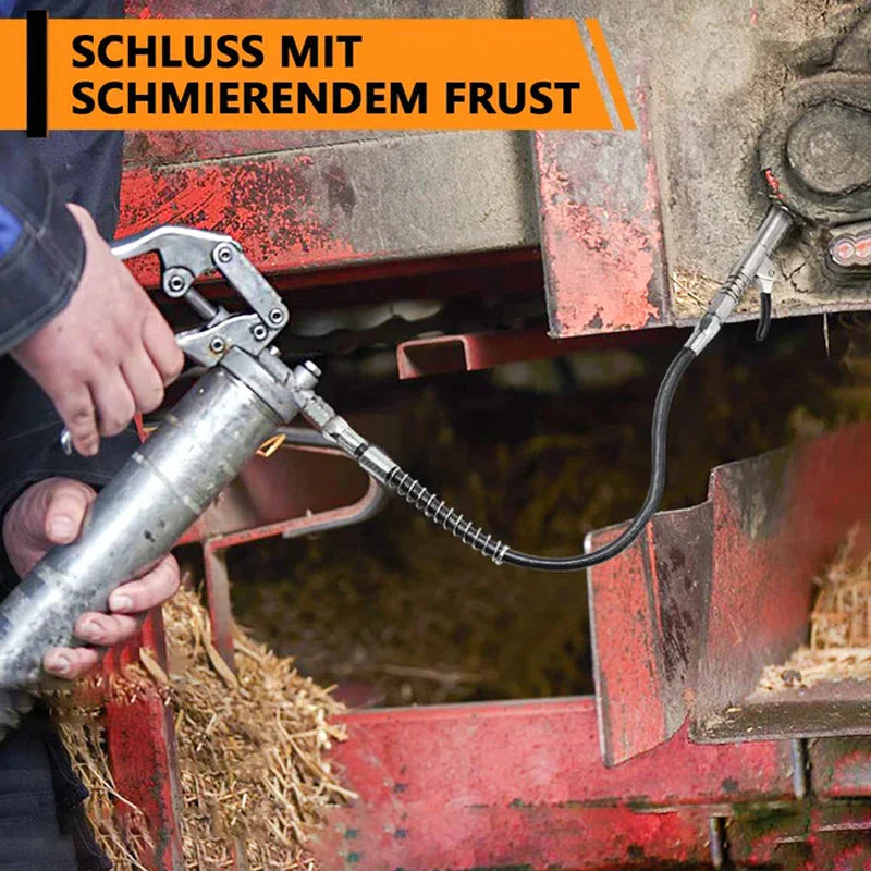 Universal Lock-On Coupler for grease guns, demonstrating its firm grip on a Zerk fitting