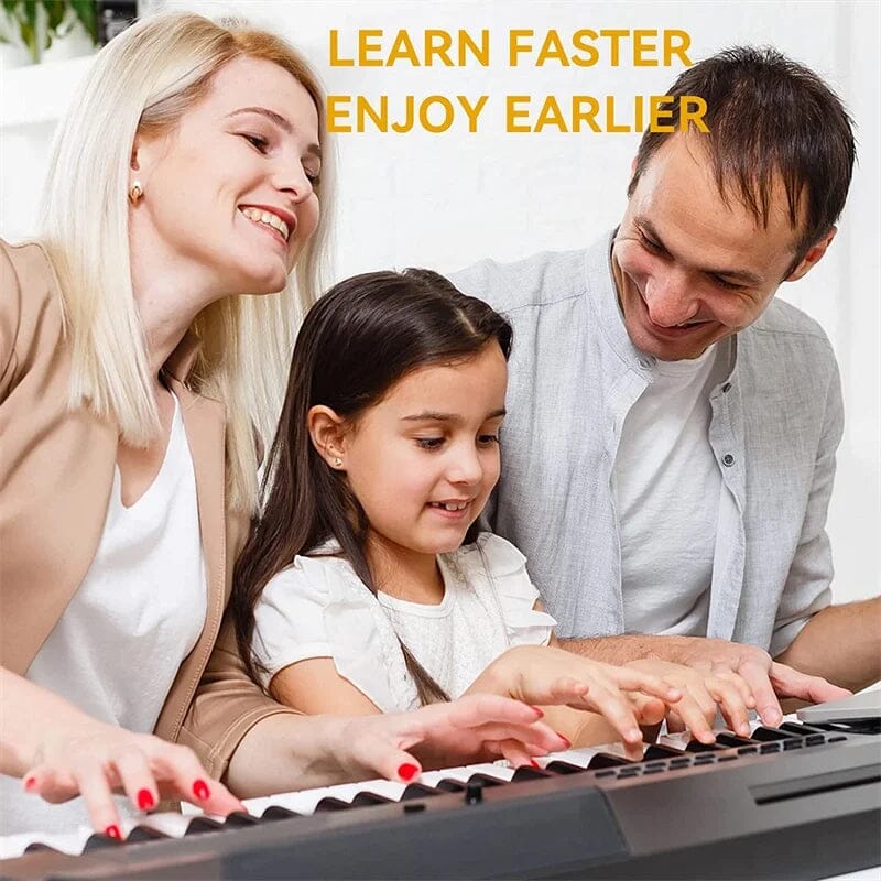 Child hands placing Universal Piano Keyboard Note Labels on white and black keys, learning aid