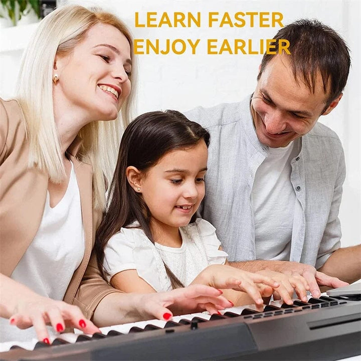 Child hands placing Universal Piano Keyboard Note Labels on white and black keys, learning aid