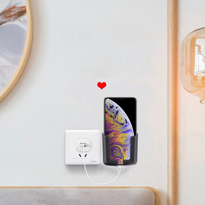 Multi-purpose sticky phone holder on a bathroom tile, displaying a phone for hands-free video