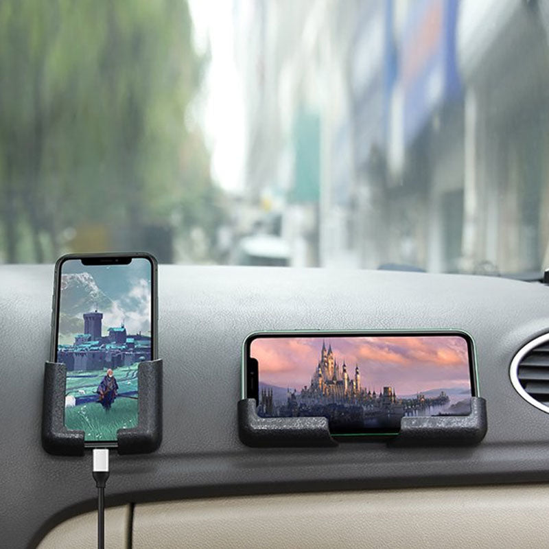 Close-up of the sticky adhesive base of the universal phone holder, showcasing its strong grip