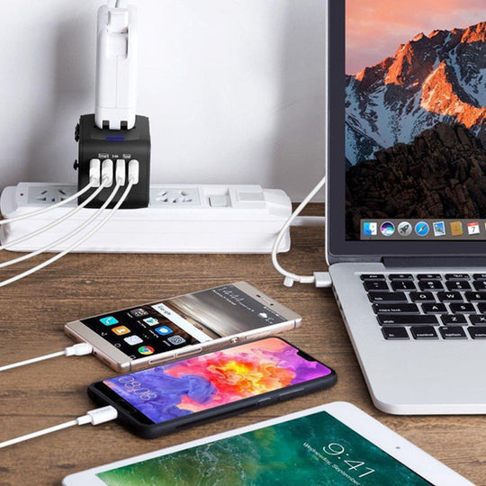 Streamlined universal power adapter with 4 USB ports for simultaneous device charging.