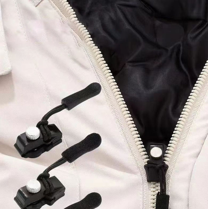 Hand holding a piece from the universal zipper repair kit, demonstrating ease of use for DIY clothing repair