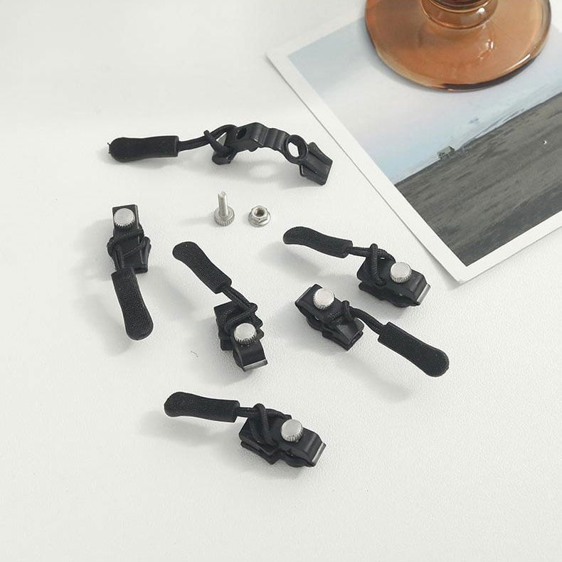 Image showing a broken zipper on a bag being repaired with the universal zipper repair kit, a practical houseware tool