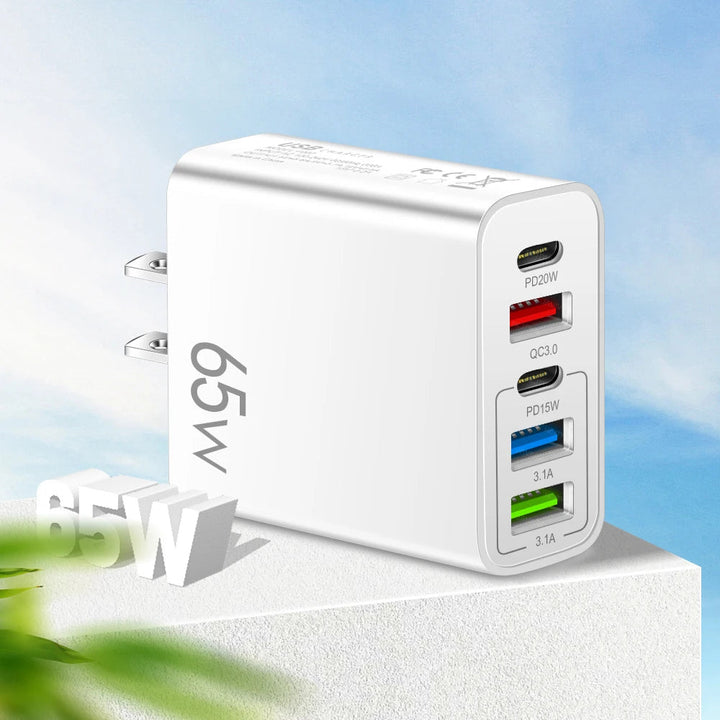 USB-C 65W multiport charger adapter shown with a smartphone and tablet charging simultaneously
