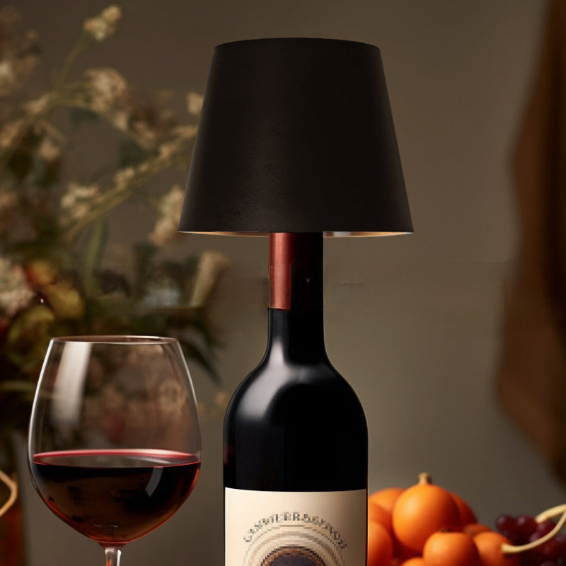 Ambient lighting from a portable USB rechargeable bottle lamp on a bookshelf