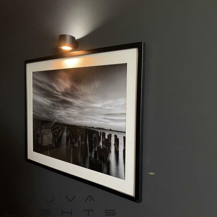 Magnetic LED Wall Sconce, dimmable, with remote control on a living room wall