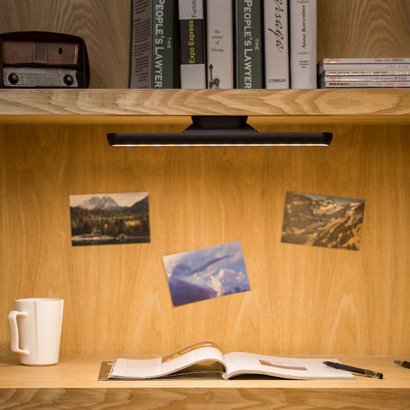 Bedroom setup with a USB rechargeable magnetic strip reading lamp on a headboard