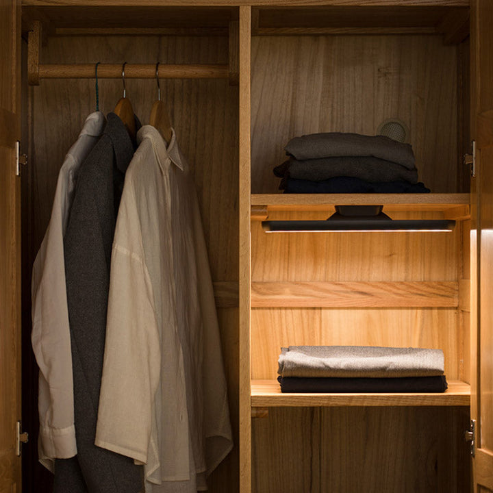 Cabinet interior illuminated by a magnetic USB rechargeable LED task light for reading