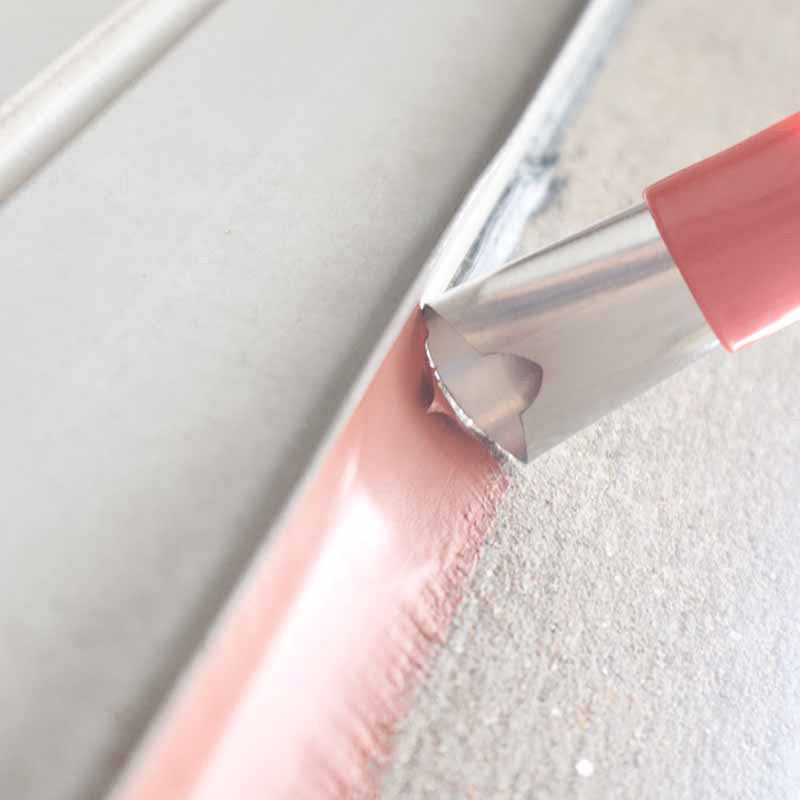 Detailed view of a caulking finisher tip, showing precision for perfect kitchen and bath seals