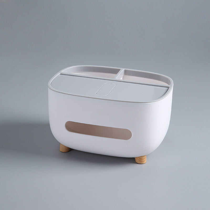 Detail view of the compartments within the multipurpose storage caddy and tissue box.