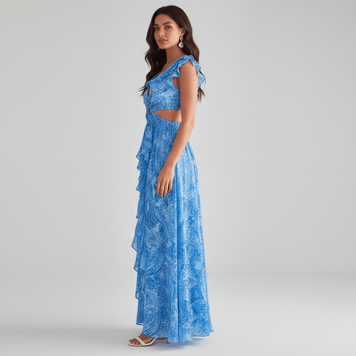 Chic women's abstract print cut-out maxi dress, a fashionable wedding guest option, featuring flowy fabric & ruffle sleeves.