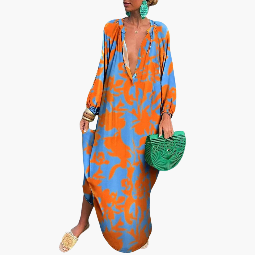Elegant women's flowy abstract print maxi dress with deep V-neck, ideal for summer beach fashion.