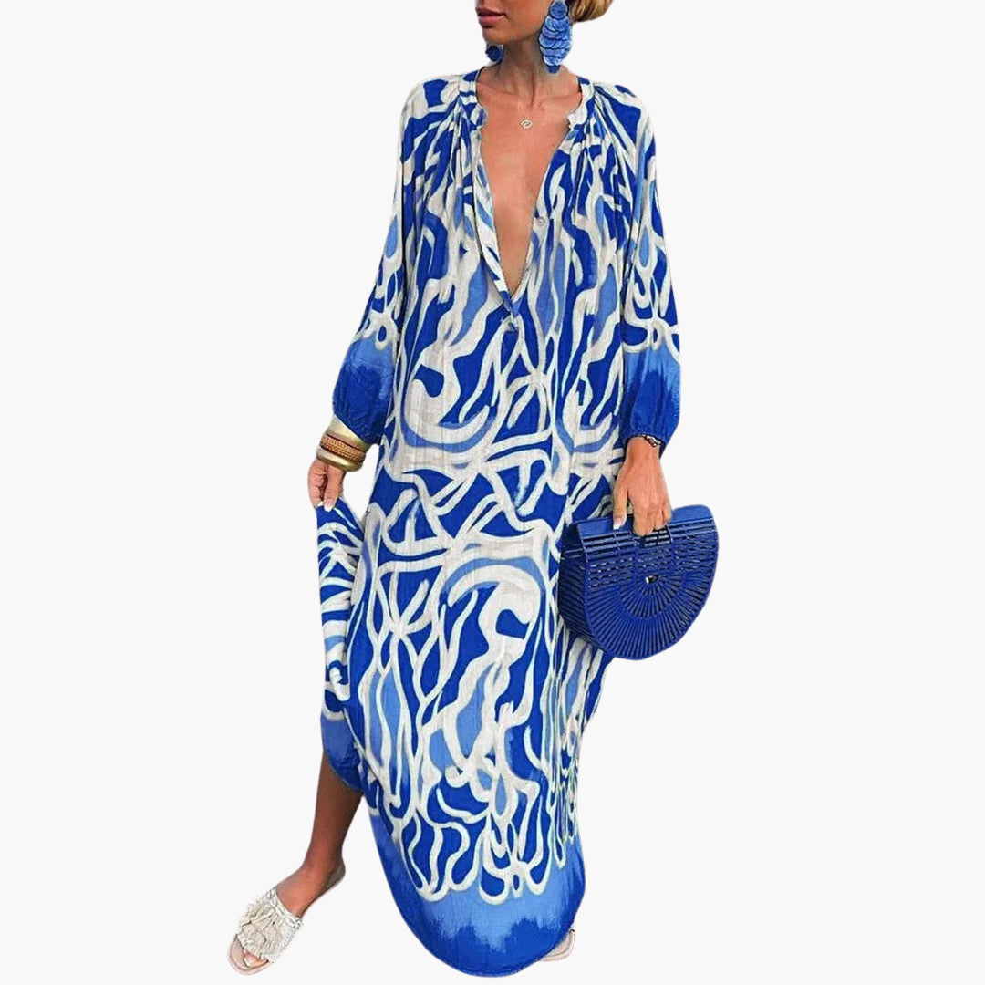 Beautiful abstract print beach maxi dress with deep V-neck, a vibrant & flowy choice for summer vacations.