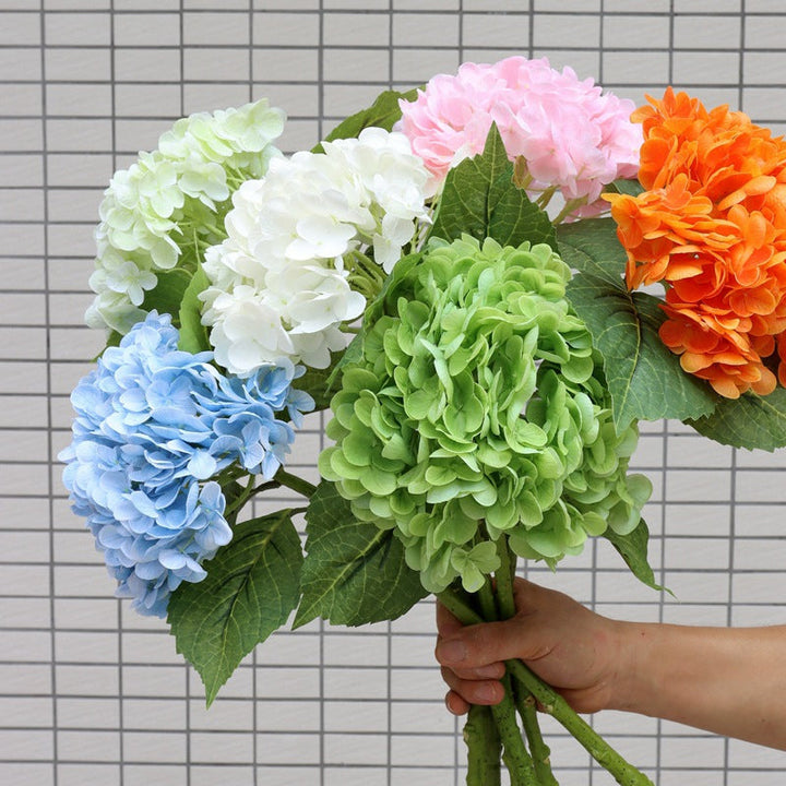 Vibrant artificial hydrangea bouquet, perfect for home decor, featuring colorful blooms and lush leaves.