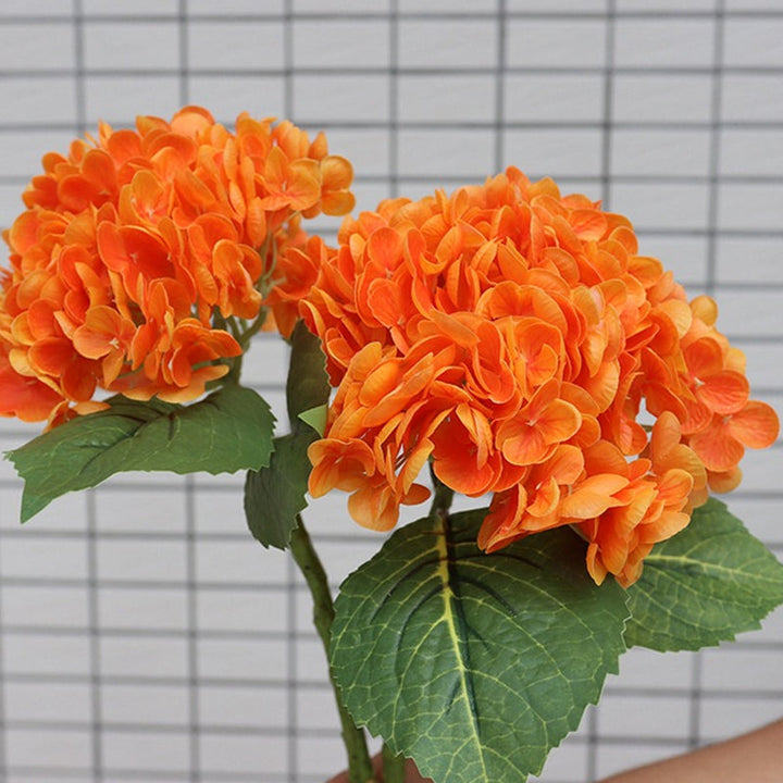 Artificial hydrangea bouquet with various colored blooms, offering a diverse floral arrangement for any setting.