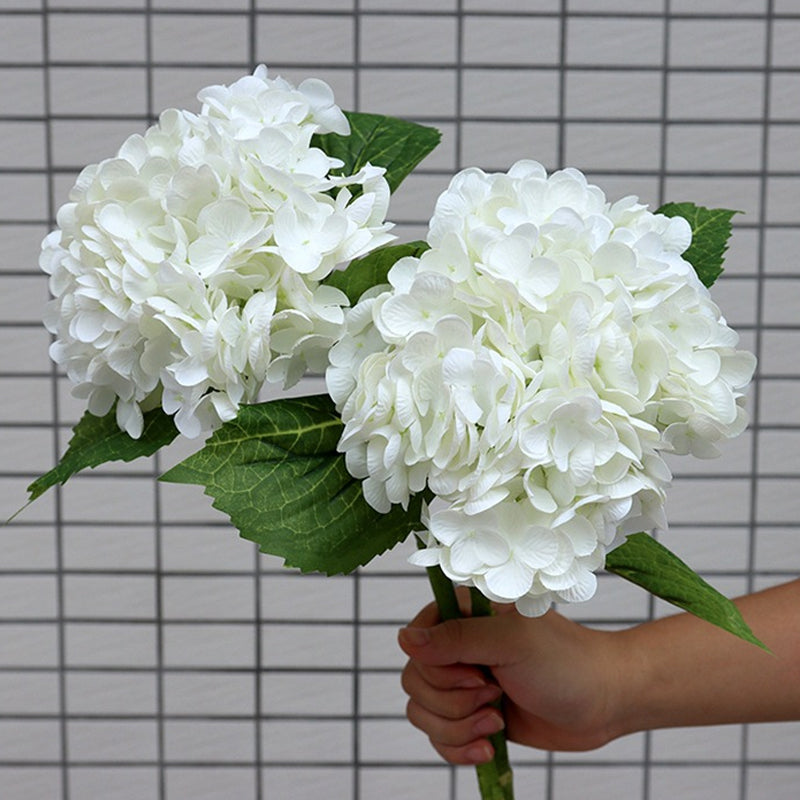 Artificial hydrangea centerpiece, offering a colorful and maintenance-free option for home decor.