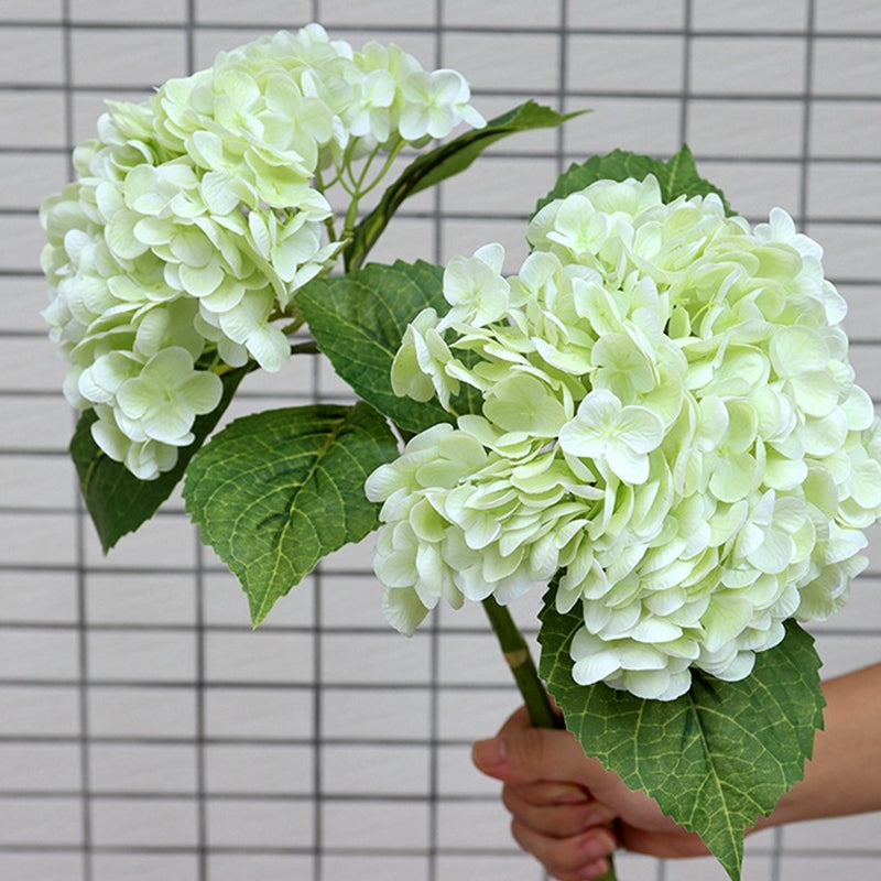 Assorted artificial hydrangea blooms, creating a delightful and attractive floral arrangement.
