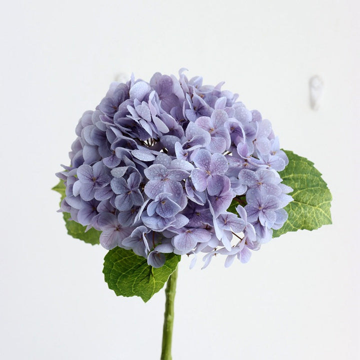 Realistic artificial hydrangea display, providing beauty without the upkeep, perfect for home decor.