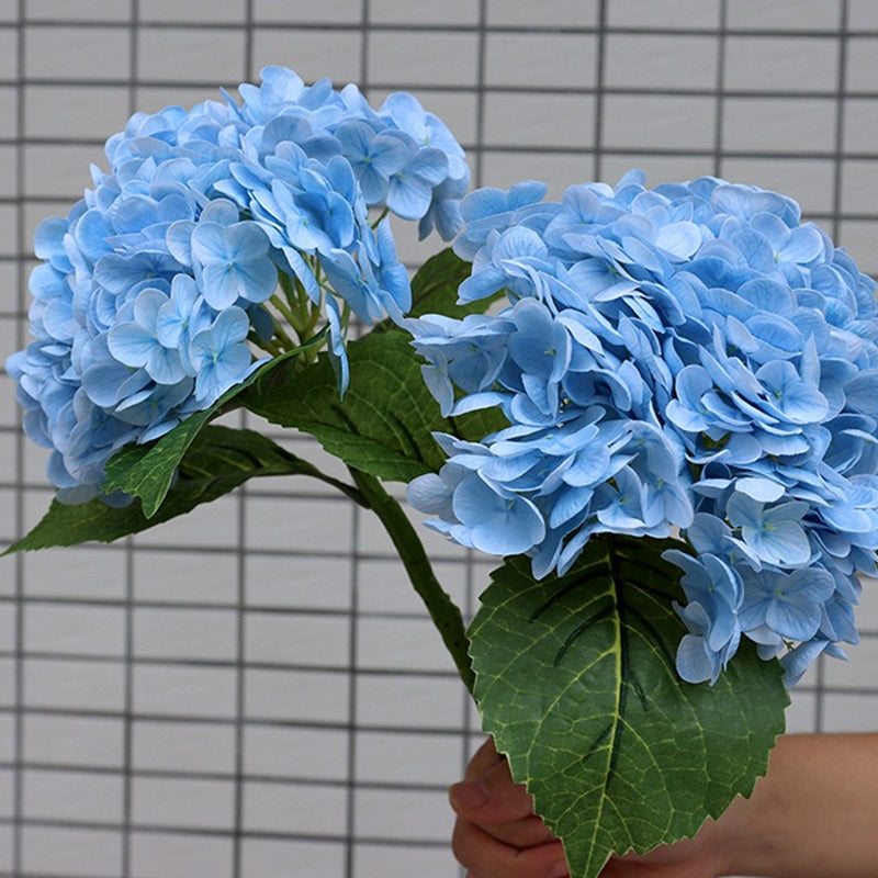 White artificial hydrangea cluster, an ideal fake plant for minimalist home decor or wedding accents.