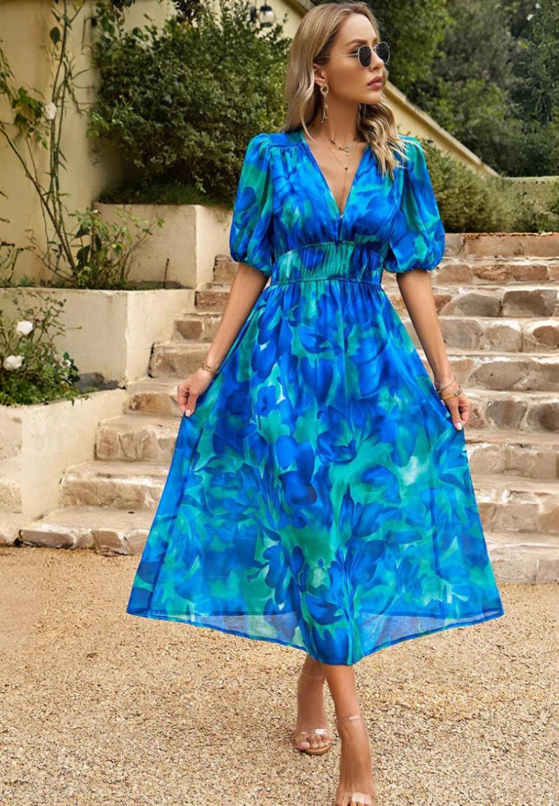 Close-up of the comfortable short sleeve on a feminine floral A-line midi dress for women.