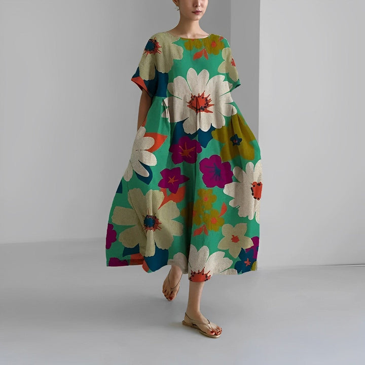 Spring-ready women's vibrant floral maxi dress, offering elegant and versatile style.