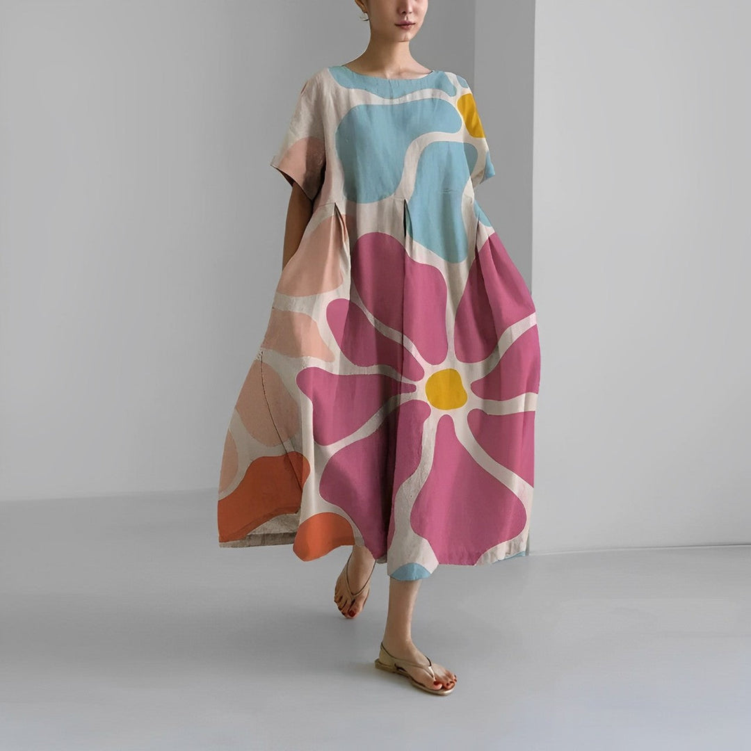 Flowy women's vibrant floral maxi dress, ideal for spring and casual wear.