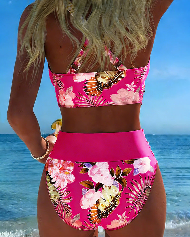Women's vibrant floral split bikini, a stylish choice for summer swim and beach activities.