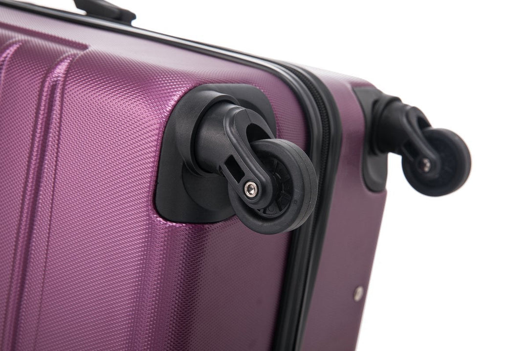 Get ready for vacation with this eye-catching purple 2-piece hardside luggage set with spinner wheels.