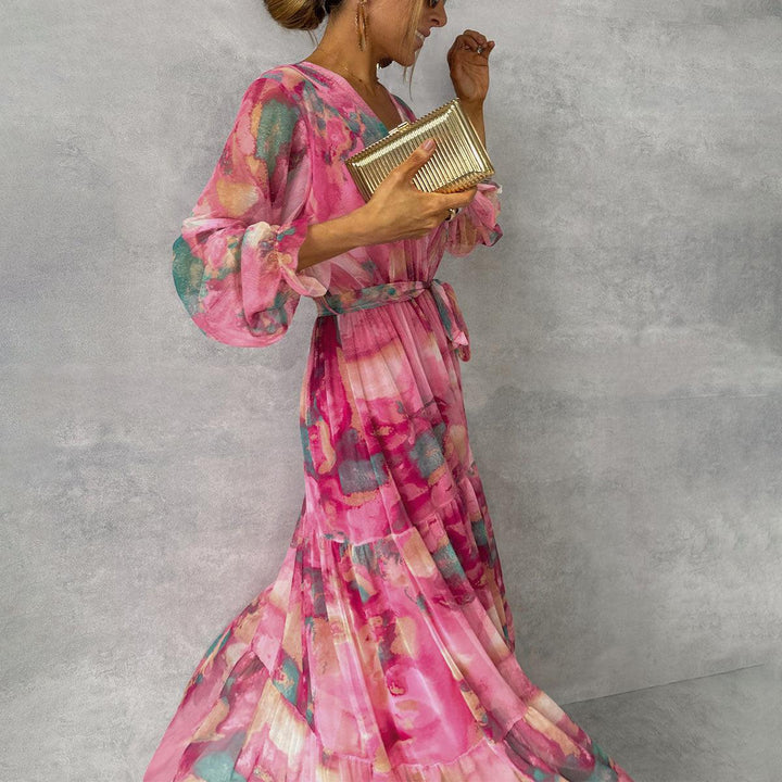 Rose red vibrant floral maxi wrap dress for women, featuring a flattering v-neck and charming ruffle sleeves.