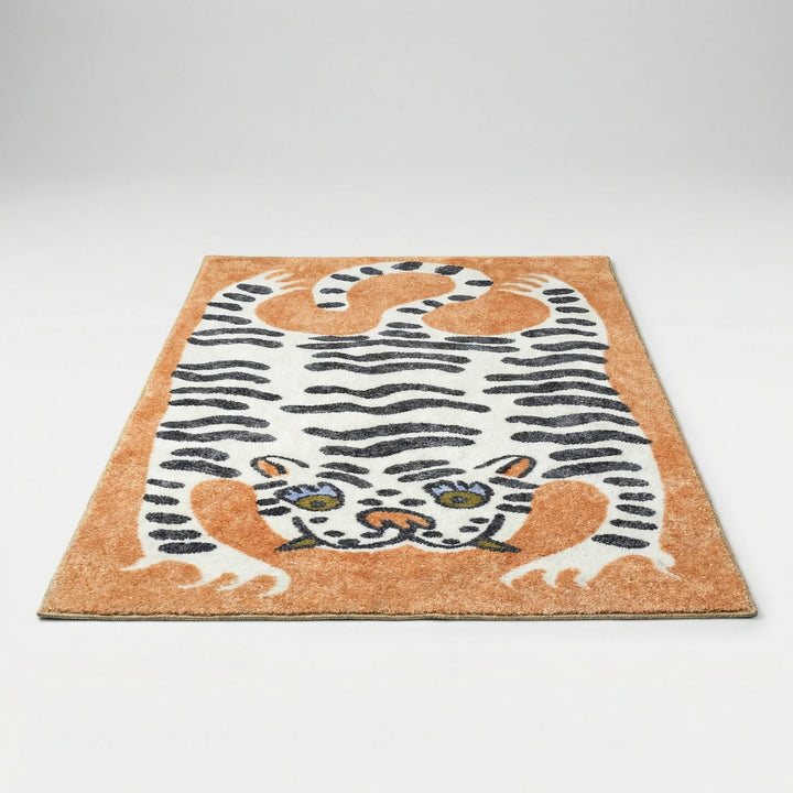 Washable tiger print area rug, ideal for kids' playrooms. Features a playful animal print design.