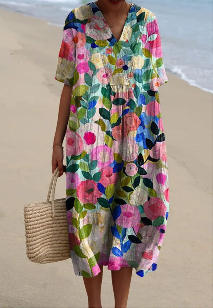 Vibrant women's floral garden print flowy midi dress, perfect for summer casual wear or a spring party.