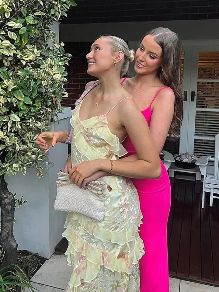 Flowy sleeveless colorful mini dress for women, ideal as a vibrant summer or party dress with ruffles.