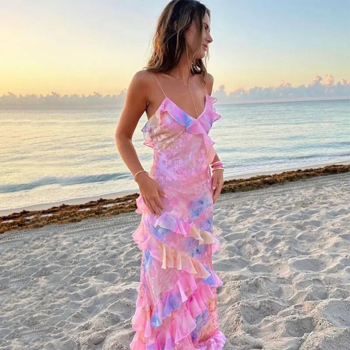 Playful vibrant women's summer dress with ruffles. A colorful mini dress, perfect for beachwear and parties.