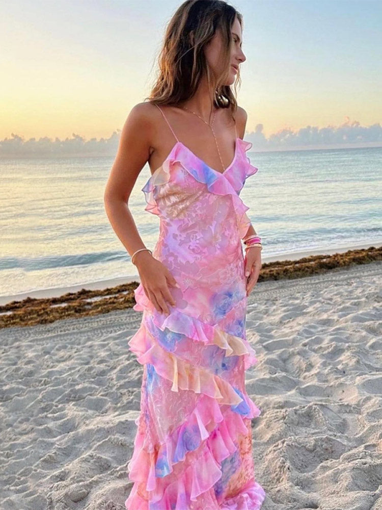 Women's vibrant sleeveless summer mini dress with playful ruffles, excellent for vacation or casual wear.