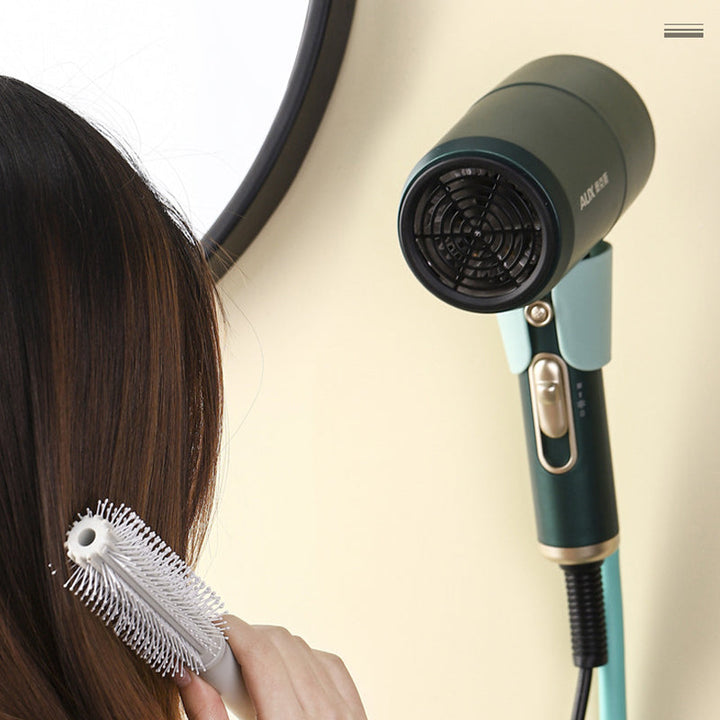 Sleek wall mounted hair dryer holder in modern bathroom, chrome finish, space-saving design