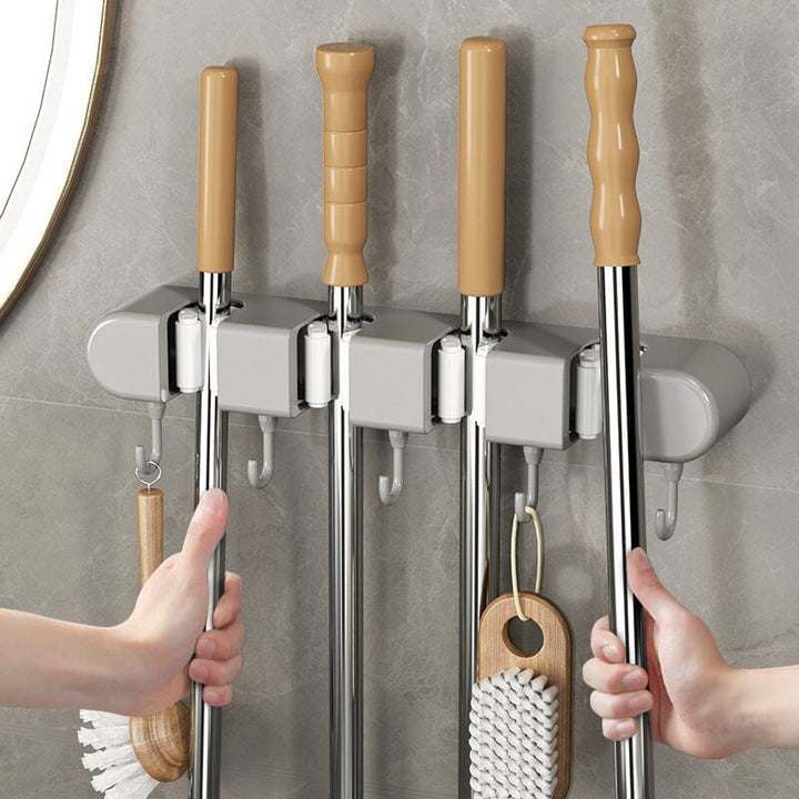 Wall-mounted mop & broom holder with 5 slots & 6 hooks for garage, kitchen, or laundry room organization
