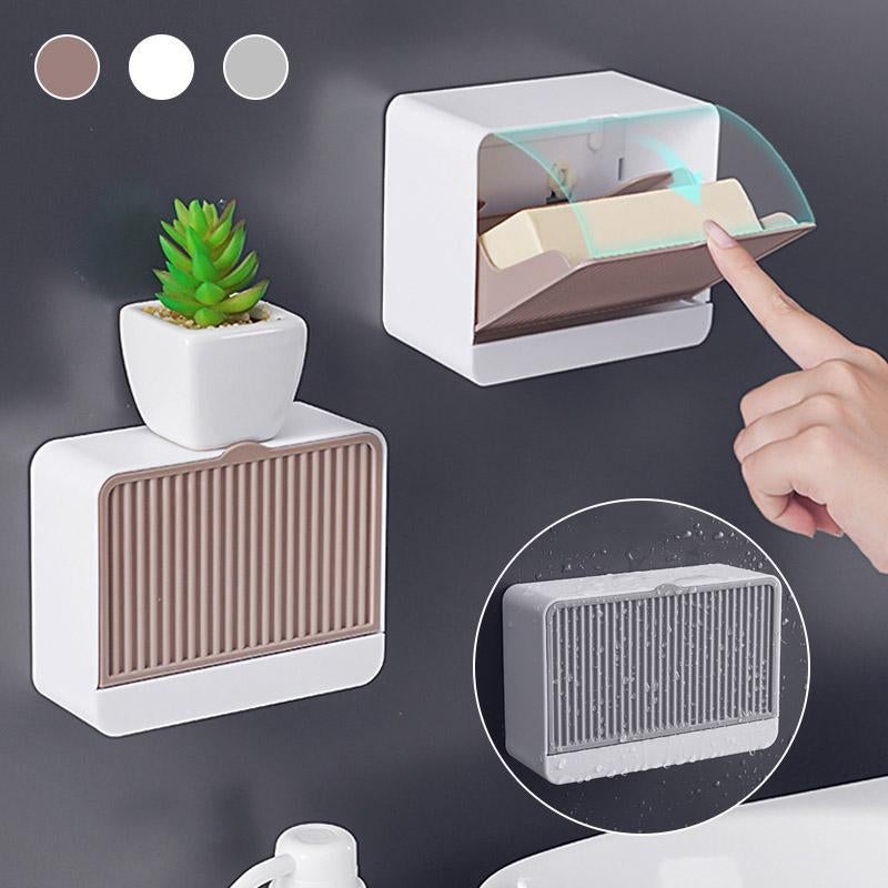 Wall-mounted self-draining soap holder, ideal for bathroom organization, in a minimalist white design.
