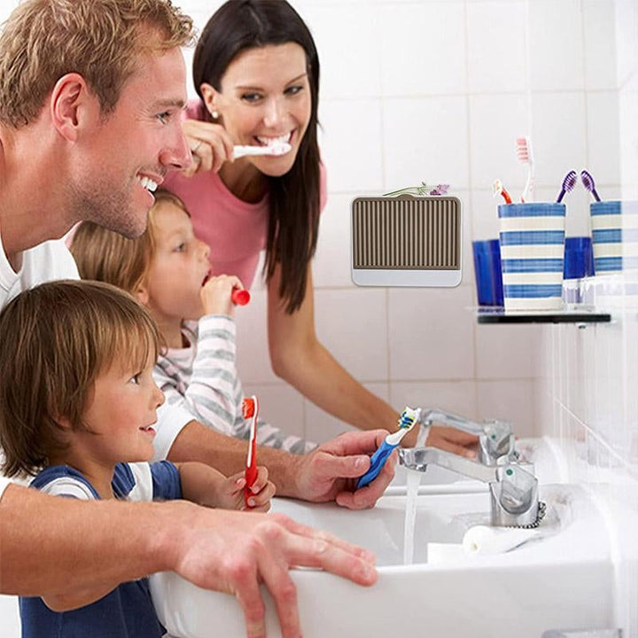 Efficient self-draining soap holder, designed for wall mounting in bathrooms and kitchens, keeps surfaces clean.