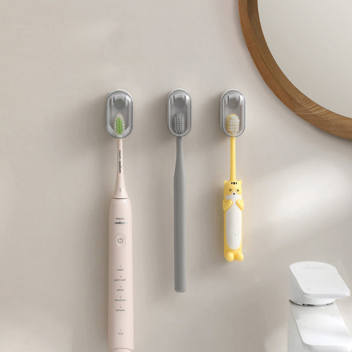Multiple toothbrushes stored neatly in wall mounted holder with cover, clean design