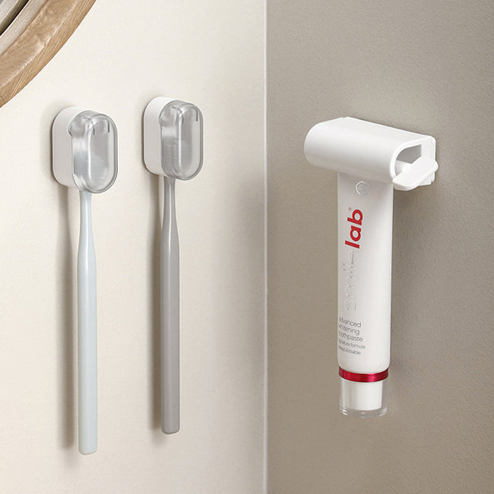 Compact wall mounted toothbrush holder with cover, saving counter space in bathroom