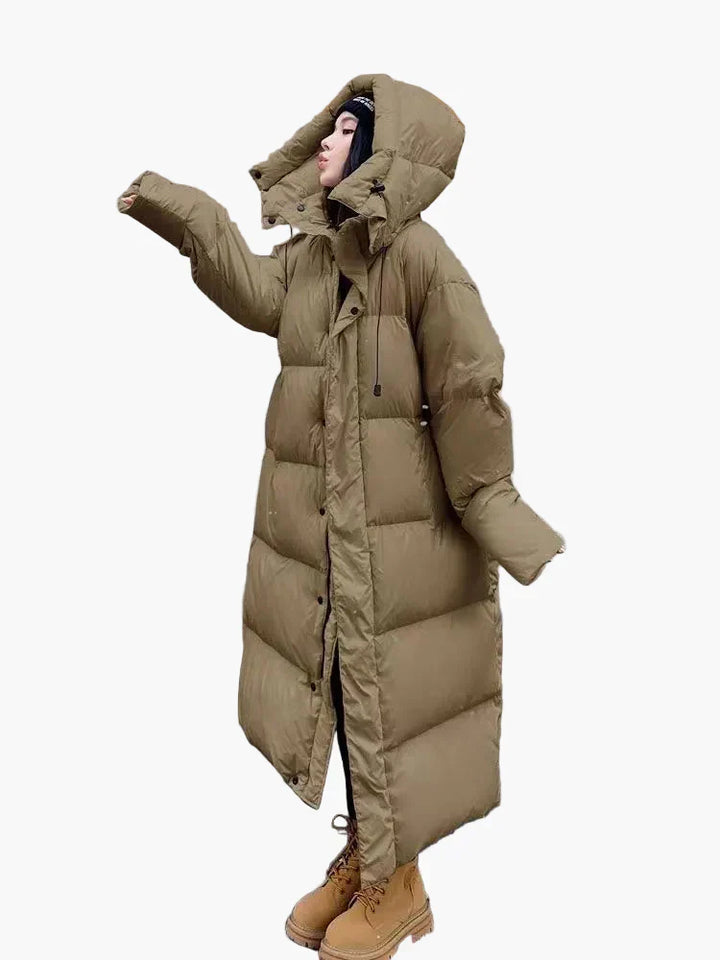 Casual women's hooded puffer coat with long quilted design, ideal for cold weather