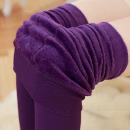 Stack of women's thermal fleece lined winter leggings in various sizes, ready for cold weather.