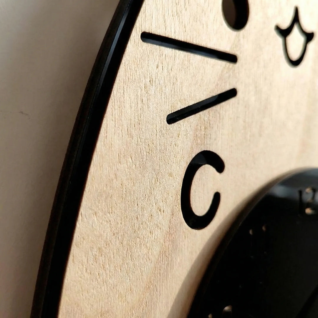 Playful animal themed cat wall clock with a unique swinging tail. Silent & decorative home accent, perfect for wall decor.