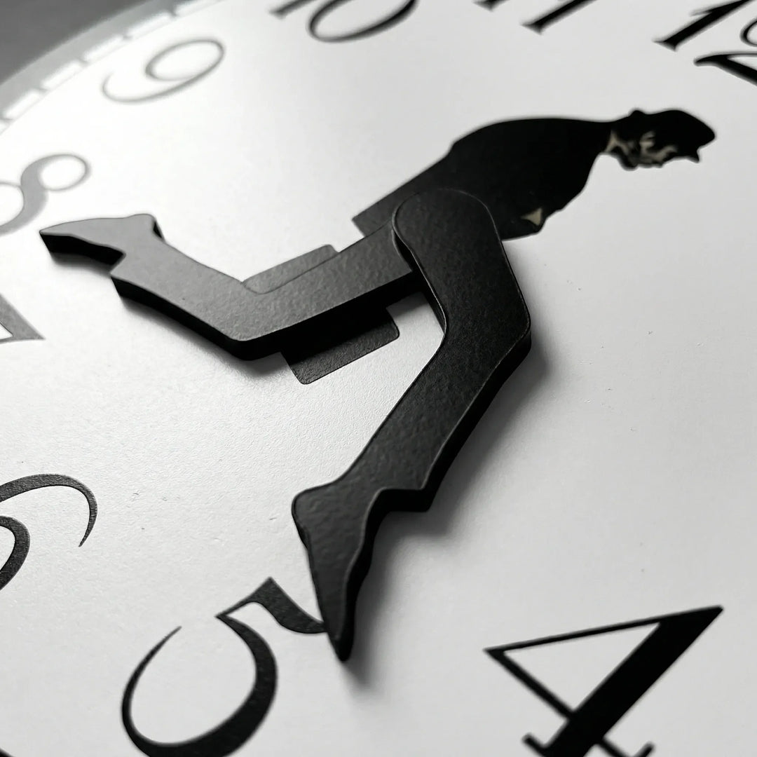 Playful modern wall clock featuring a whimsical design. Silent, battery-powered movement for quiet home decor.