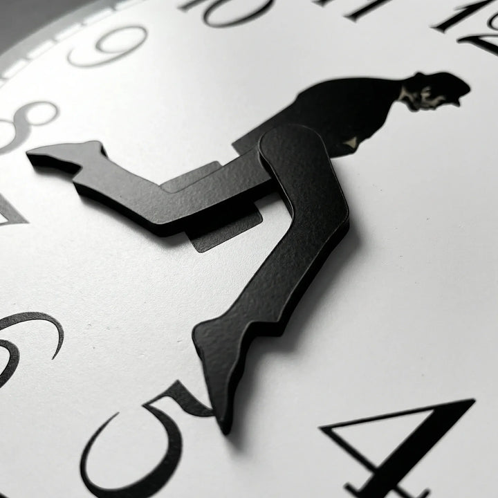 Playful modern wall clock featuring a whimsical design. Silent, battery-powered movement for quiet home decor.